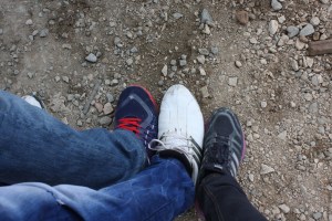 Trying to swap shoes. Ahmad's friend on the left, Ahmad in the middle, my 'baby feet' on the right.